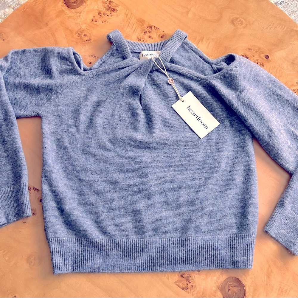 Brand new off the shoulder sweater! Light blue soft material. Unique neckline.